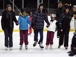 Nancy Gillis, left, Sarah Gillis, 9, Evan Arvic, 14, Madalyn Gillis, 7, and Elsie Arvic enjoy a New Year's Eve skate at Lanspeary Park on Dec. 31, 2012.