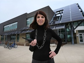 Vice-principal Paula Tullio stands in front of Dr. David Suzuki Public School on Wednesday, Dec. 16, 2015, one of many locations where the public school board has solar panel projects.