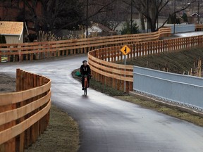 Oliver Swainson, a member of Bike Friendly Windsor Essex, takes a ride along Herb Gray Parkway trail system near Cousineau Road bridge.