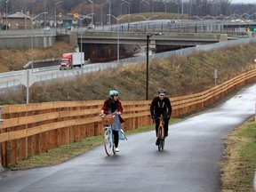 In this file photo, Oliver Swainson, right, and Christina Benneian, members of Bike Friendly Windsor Essex cruise along Herb Gray Parkway trail system near Cousineau Road bridge Tuesday December 22, 2015.