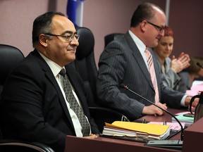 Onorio Colucci, left, is announced as new City of Windsor Chief Administrative Officer by Windsor Mayor Drew Dilkens and applauded by City Clerk Valerie Critchley, right, at end of City Council meeting Monday, Jan. 4, 2016.