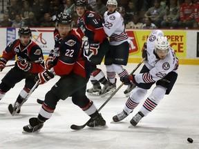 Tecumseh's Joe Manchurek, right, battles Spitfires Brendan Lemieux in OHL action from WFCU Centre January 14, 2016. Behind, Spits Aaron Luchuk, left, and Connor Chatham join the play along with Generals Anthony Cirelli.