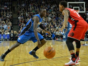 Orlando Magic Victor Oladipo (L) runs by Toronto Raptors Kyle Lowry during the NBA Global Game London 2016 basketball match between Orlando Magic and Toronto Raptors at the O2 Arena in London on January 14, 2016. AFP PHOTO / GLYN KIRKGLYN KIRK/AFP/Getty Images