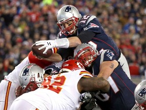 Tom Brady #12 of the New England Patriots scores a touchdown in the second quarter against the Kansas City Chiefs during the AFC Divisional Playoff Game at Gillette Stadium on January 16, 2016 in Foxboro, Massachusetts.  (Photo by Jim Rogash/Getty Images)