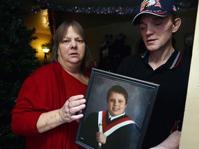 Lori Maukonen and Jeff Harris, parents of injured roofer Michael Maukonen, are pictured in their home in this December 2015 file photo.