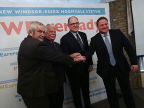 Tom Bain, Percy Hatfield, Drew Dilkens and Taras Natyshak (left to right) pose for a photo during a press conference to show support of the new hospital at the Fogolar Furlan Club in Windsor on Monday, January 25, 2016. A new hashtag was unveiled and a letter of support signed by local politicians will be sent to the Ontario Minister of Health. (TYLER BROWNBRIDGE/The Windsor Star)