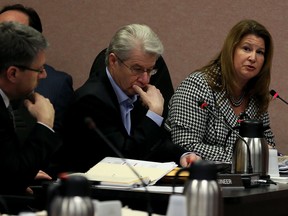 Melissa Osborne, right, City of Windsor senior manager of asset planning answers questions regarding electric charging stations for EVs during City Council Executive Committee meeting January 25, 2016. Listening is Sergio Grando, centre, manager of energy initiatives with City of Windsor (NICK BRANCACCIO/Windsor Star)