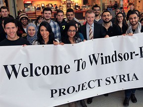 University of Windsor President Alan Wildeman, centre, joined about two dozen students for Project Syria to support local Syrian refugees at CAW Student Centre Jan. 27, 2016. Project Syria reached out to our local refugees and asked them for personal requests. Students the general public were asked to bring donation to the event.