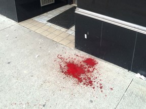 Windsor police are investigating after a puddle of blood was discovered on a downtown sidewalk on Jan. 8, 2016. (Doug Schmidt/Windsor Star)