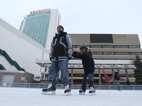 Brian Phaneuf and his son Austin skate at Charles Clarke Square in downtown Windsor, Ontario on January 25, 2016. Mild temperatures are in the forecast for southwestern Ontario. (JASON KRYK/WINDSOR STAR)