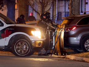 Windsor police ESU, K-9 unit and uniform officers contain a home on St. Luke Road Tuesday evening.  Neighbours say police arrived around 5 p.m. and St. Luke was blocked in both directions.