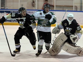 LaSalle Vipers Nathan Veres, left, battles St. Thomas Stars Lucas Mastroianni in Jr. B hockey action from Vollmer Jan. 27, 2016.  Vipers goaltender Colin Tetreault, right, played part of the first period after starter Paola Battisti was pulled.