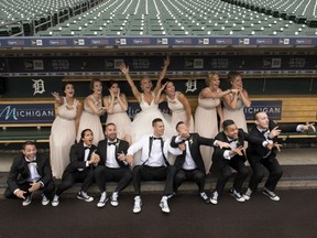 After their first look, Erin and Lyle Kane and their wedding party went to Comerica Park for some photos behind the scenes and in the dugout on their rainy wedding day. - Clarissa Mitchell: Clarissa Marie Photography