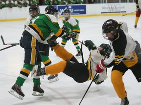 Riverside Rebels Cameron Pickersgill goes flying during a collision with Lajeunesse player Zach Garvey during WECSSAA Boys hockey action at the WFCU Centre in Windsor, Ontario on January 4, 2016. (JASON KRYK/WINDSOR STAR)