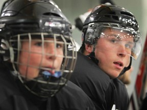 Tecumseh's Kerby Rychel, right, and Jack Probert watch the action at the inaugural Probert Classic at Tecumseh Arena. (DAN JANISSE/The Windsor Star)