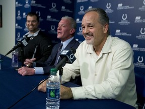 Indianapolis Colts head coach Chuck Pagano speaks after the announcement of his contract extension as owner Jim Irsay and general manager Ryan Grigson looks on during a press conference at the NFL team's practice facility in Indianapolis, Monday, Jan. 4, 2016. (AP Photo/Michael Conroy)