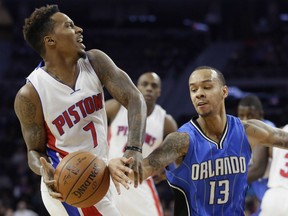 Orlando Magic guard Shabazz Napier (13) fouls Detroit Pistons guard Brandon Jennings (7) during the first half of an NBA basketball game, Monday, Jan. 4, 2016, in Auburn Hills, Mich. (AP Photo/Carlos Osorio)