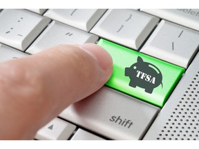 Business concept finger pressing Canadian TFSA enter key on metallic keyboard. Image by fotolia.com.