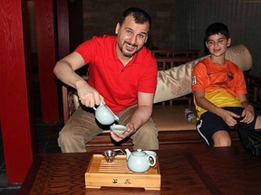 Canadian Salim Alaradi, left, and his son, Mohamed Alaradi are shown on a family vacation in the United Arab Emirates in a 2013 family handout photo.