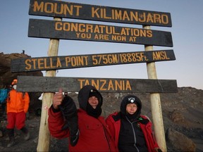Richard and Jessica Vennettilli celebrate reaching the summit of Mount Kilimanjaro in July 2015.