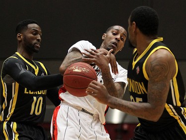 The Windsor Express' Brandon Robinson gets caught between the London Lightnings Warren Ward and Akeem Wright (right) during the Clash at the Colosseum at Caesars Windsor on Wednesday, Feb. 3, 2016.