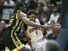 Windsor's Maurice Bolden battles London's Akeem Wright under the basket during NBLC action between the Windsor Express and the London Lightning at the WFCU Centre, Friday, Jan. 22, 2016.