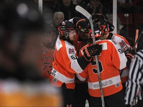 The Essex 73's celebrate after their second goal of the first period in the opening game of the Schmalz Cup quarter final series between the Essex 73's and the visiting Exeter Hawks at Essex Arena, Tuesday, March 17, 2015.