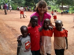 Ingrid Silvaggio Heugh is pictured with four children in Buwundo, Ugana. The boy on the far right is her sponsored child, four-year-old Njuki Junior.