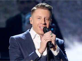 In this Nov. 22, 2015 photo, Macklemore performs at the American Music Awards in Los Angeles.