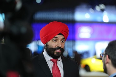 Federal Minister of Innovation, Science and Economic Development Navdeep Bains speaks with the media at the 2016 North American International Auto Show on Jan. 12, 2016 in Detroit, Mich.