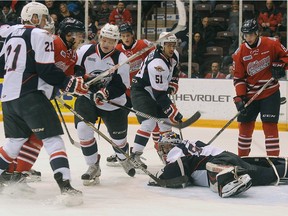 Oshawa Generals' Joe Manchurek tries to score against Windsor Spitfires' goalie Michael DiPietro in OHL hockey action at the GM Centre in Oshawa on Sunday, January 10, 2016.