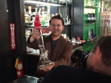 Higher Limits co-owner Jon Liedtke shows a glass bong at 251 Ouellette Ave.