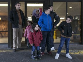 The Al-Hoshan family waits to be picked up by a Syrian volunteer to be taken on a shopping trip, Sunday, Jan. 3, 2016.  The Al-Hoshan family are refugees from Syria who recently arrived in Windsor and are staying at the Days Inn in downtown Windsor.