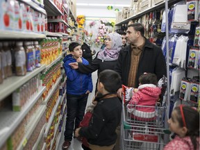 The Al-Hoshan family shops at Dollarama Sunday, Jan. 3, 2016.  The Al-Hoshan family are refugees from Syria who recently arrived in Windsor and are staying at the Days Inn in downtown Windsor.