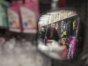 Omar Al-Hoshan shops for items for his family at Dollarama Sunday, Jan. 3, 2016.  The Al-Hoshan family are refugees from Syria who recently arrived in Windsor and are staying at the Days Inn in downtown Windsor.