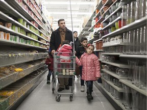 The Al-Hoshan family shops at Dollarama Sunday, Jan. 3, 2016.  The Al-Hoshan family are refugees from Syria who recently arrived in Windsor and are staying at the Days Inn in downtown Windsor.