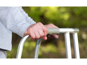 Senior using a walker. Photo by fotolia.com.