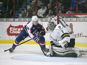 Windsor's Luke Boka is stopped by London's Tyler Parsons during OHL action between the Windsor Spitfires and the London Knights at the WFCU Centre in this 2015 file photo.