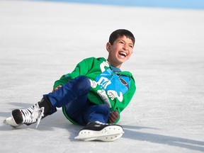 Mohammed Ashahmy, an 11-year-old Syrian refugee, laughs after falling to the ice at Charles Clark Square in downtown Windsor on Jan. 30, 2016.