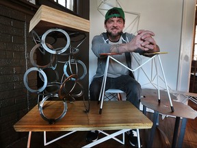Matt Cator is shown on Tuesday, Jan. 5, 2016, with some of the artistic tables he built. He challenged himself to build a table per week which he is posting on Instagram. The tables are becoming very popular on the social media platform.