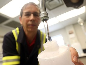 Patrick  McQuarrie, Sr. Laboratory Technician with Windsor Utilities during daily sampling of water at the A.H. Weeks Water Treatment Plant in Windsor, Ont.