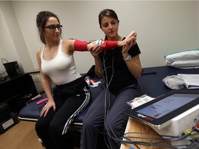 Shaelyn Poisson works with physiotherapist Jocelyn Comartin at Hotel Dieu Grace Hospital Tayfour Campus in Windsor on Thursday, December 10, 2015. Poisson is recovering from a stroke she suffered after injuring her neck.