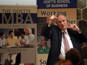 Pete Mateja, co-director, office of automotive and vehicle research at University of Windsor, speaks at the Breakfast of Champions series held by Odette Business School at the Giovanni Caboto Club of Windsor on Dec. 5, 2011.