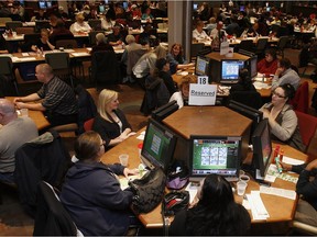 Bingo players watch electronic boards and dab conventional cards at Breakaway Gaming on Crawford Avenue Saturday December 5, 2009.