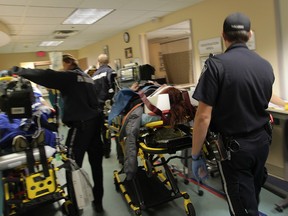 WINDSOR, ONT.: OCT. 20, 2011 -- EMS paramedics, patients and emergency room staff navigate through a jam packed hallway at Windsor Regional Hospital in Windsor, Ontario on October 20, 2011.  Windsor Regional Hospital is experiencing high volumes of patients attending the Emergency department  as well as high volumes of ALC (Alternative Level of Care) patients at the Met Campus.  (JASON KRYK/ The Windsor Star)