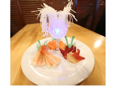 Patrons at Taka Japanese Sushi and Thai Food Restaurant are using the restaurant's iPads to order dishes like this sashimi.