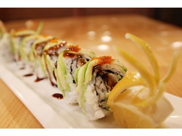 Patrons at Taka Japanese Sushi and Thai Food Restaurant are using the restaurant's iPads to order dishes like this popular green dragon roll sushi.