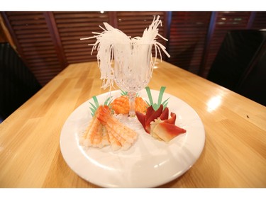 Patrons at Taka Japanese Sushi and Thai Food Restaurant are using the restaurant's iPads to order dishes like this sashimi.