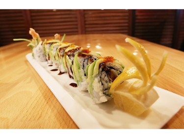 Patrons at Taka Japanese Sushi and Thai Food Restaurant are using the restaurant's iPads to order dishes like this popular green dragon roll sushi.