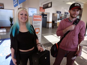 Trisha Hamilton-Poupard, left, and Anthony Poupard prepare to depart at Windsor International Airport Feb. 1, 2016.